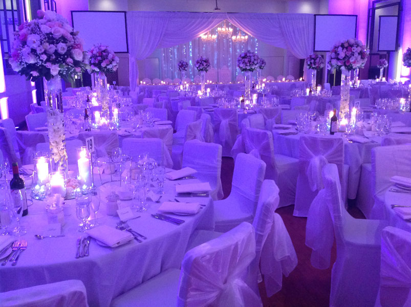 wedding centrepiece with candles and flowers